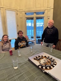 Noah eating with birthday cookie cake